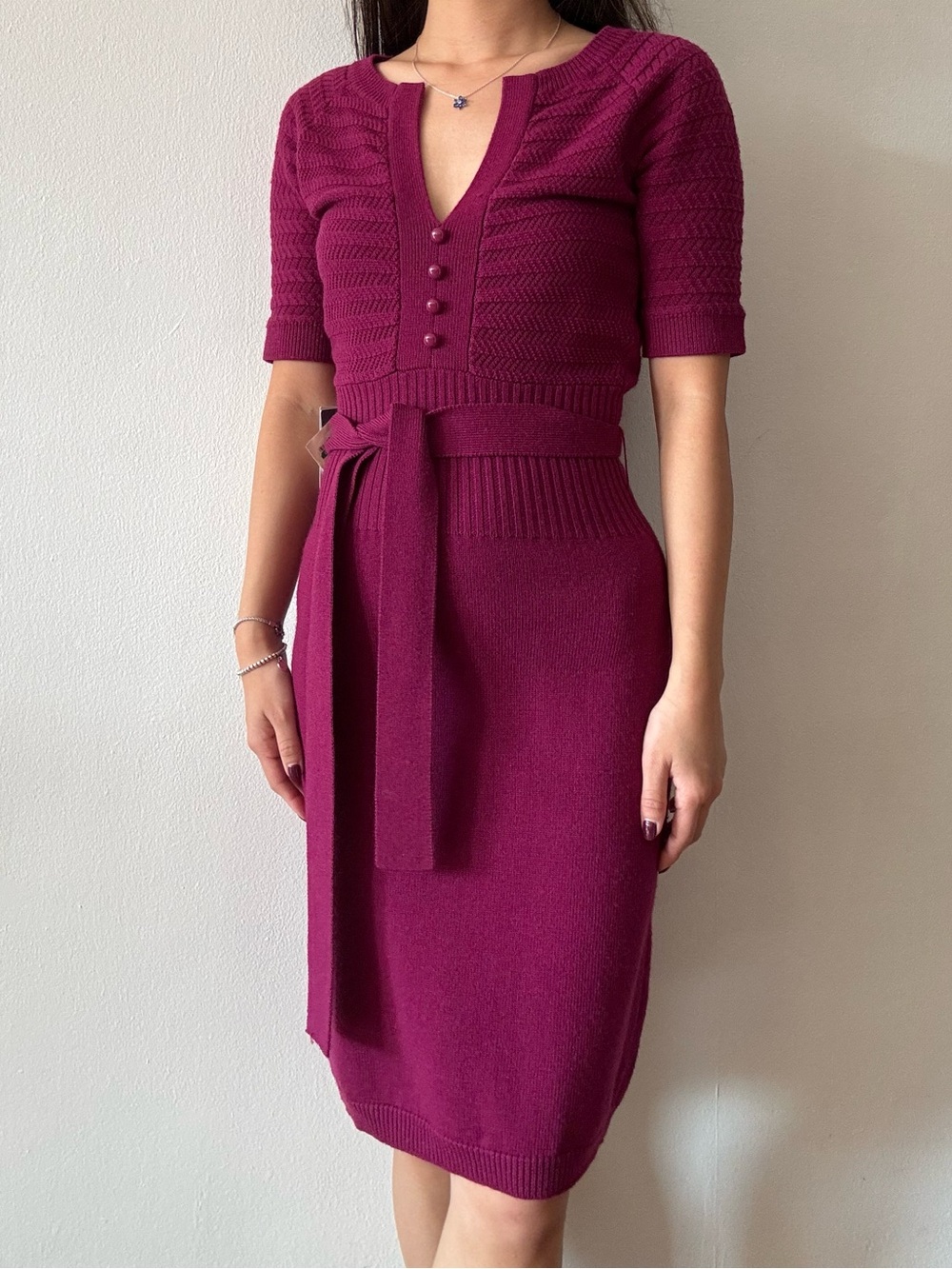 magenta knit dress with tie belt and button detail